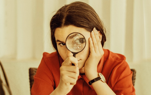 Person reviewing details closely